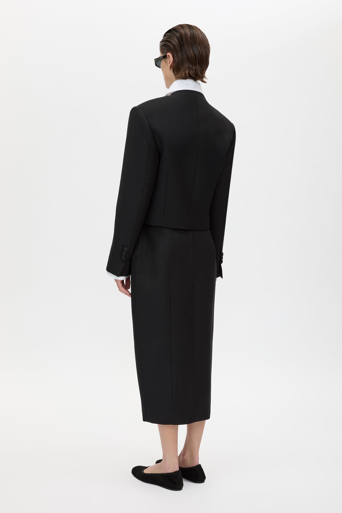 Back view CAMILLA AND MARC Caius Relaxed Cropped Blazer in Black with collarless neckline in Australian wool.