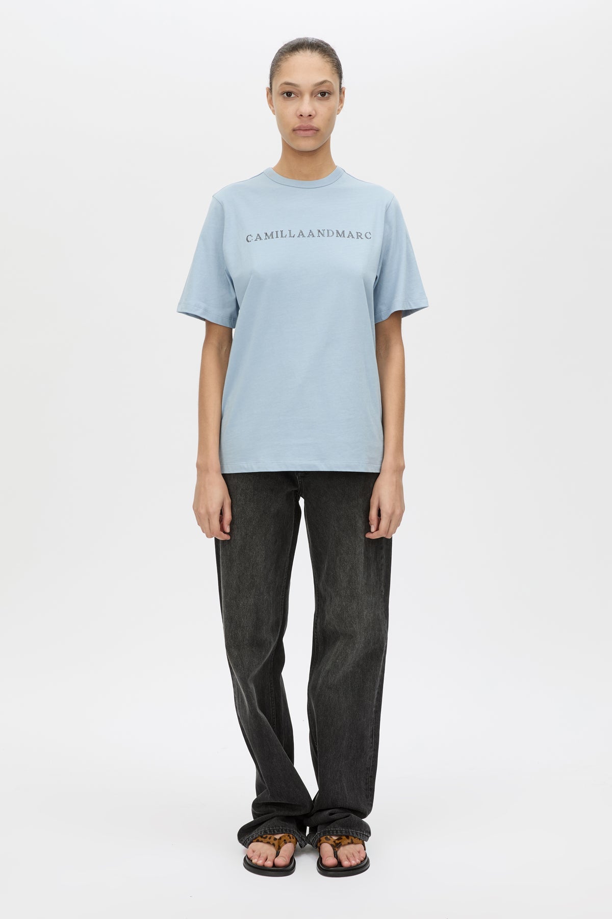 Front view CAMILLA AND MARC Athea short sleeve monogram tee in sky blue with contrast logo print.