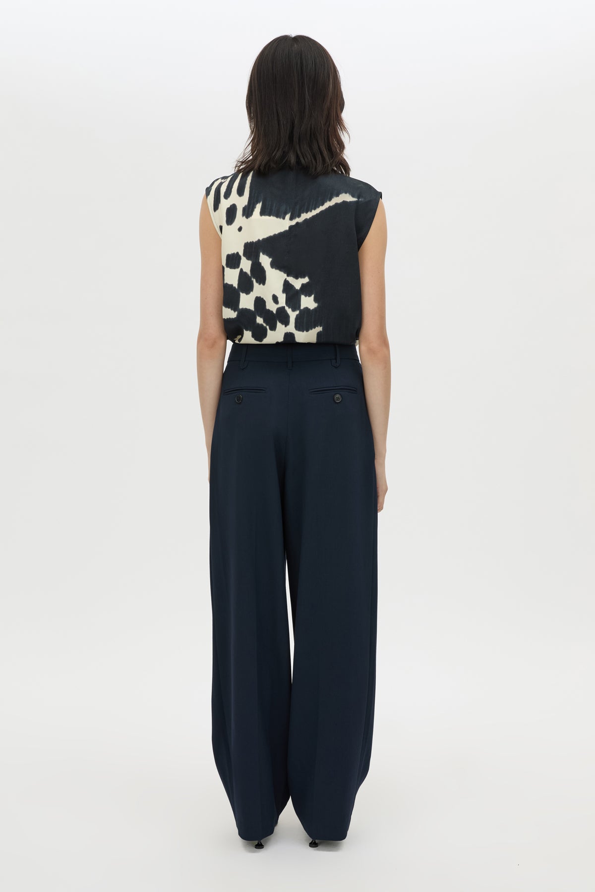 Back view CAMILLA AND MARC Asper Top in Navy print with sleeveless shell silhouette and high neckline.