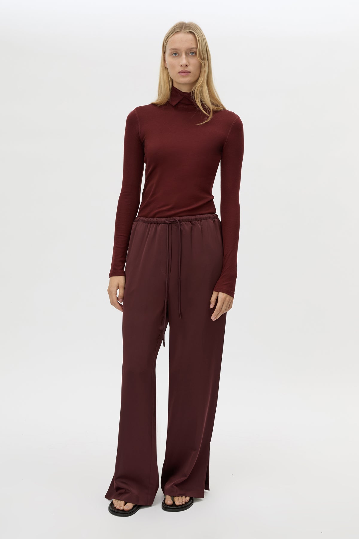 Front view CAMILLA AND MARC Barre High Neck Top in Burgundy styled with the Ground Satin Pant.
