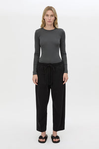 Front styled view CAMILLA AND MARC Beau Tapered Crop Pant in Black with elasticated waistband.