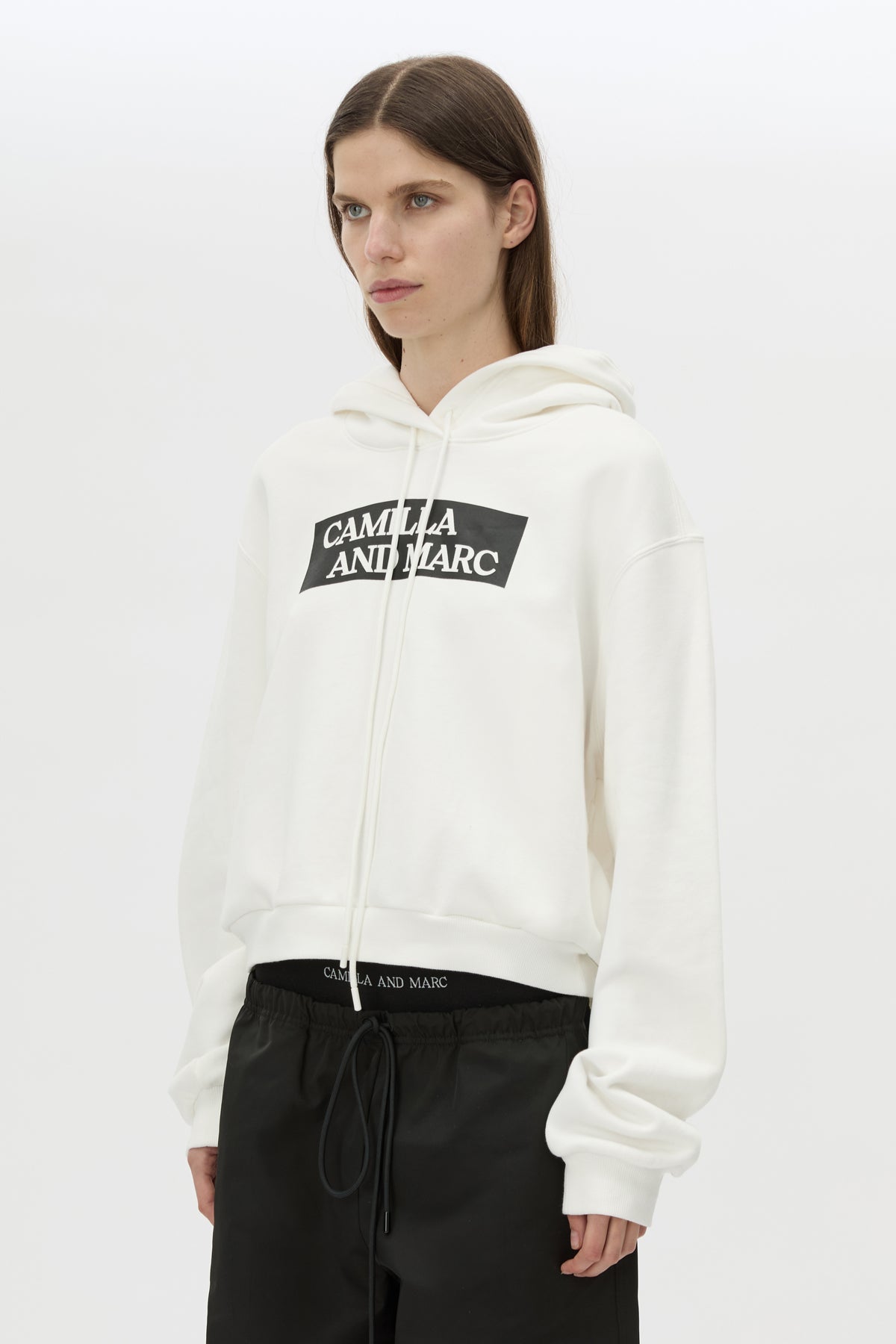 Cropped view CAMILLA AND MARC Carmont Graphic Hoodie in Soft White with boxy fit and black graphic logo.