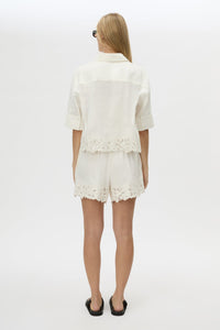 Back view CAMILLA AND MARC Chara Embroidered Cropped Shirt in Cream with short sleeves, lace hem and slight A‑line fit.