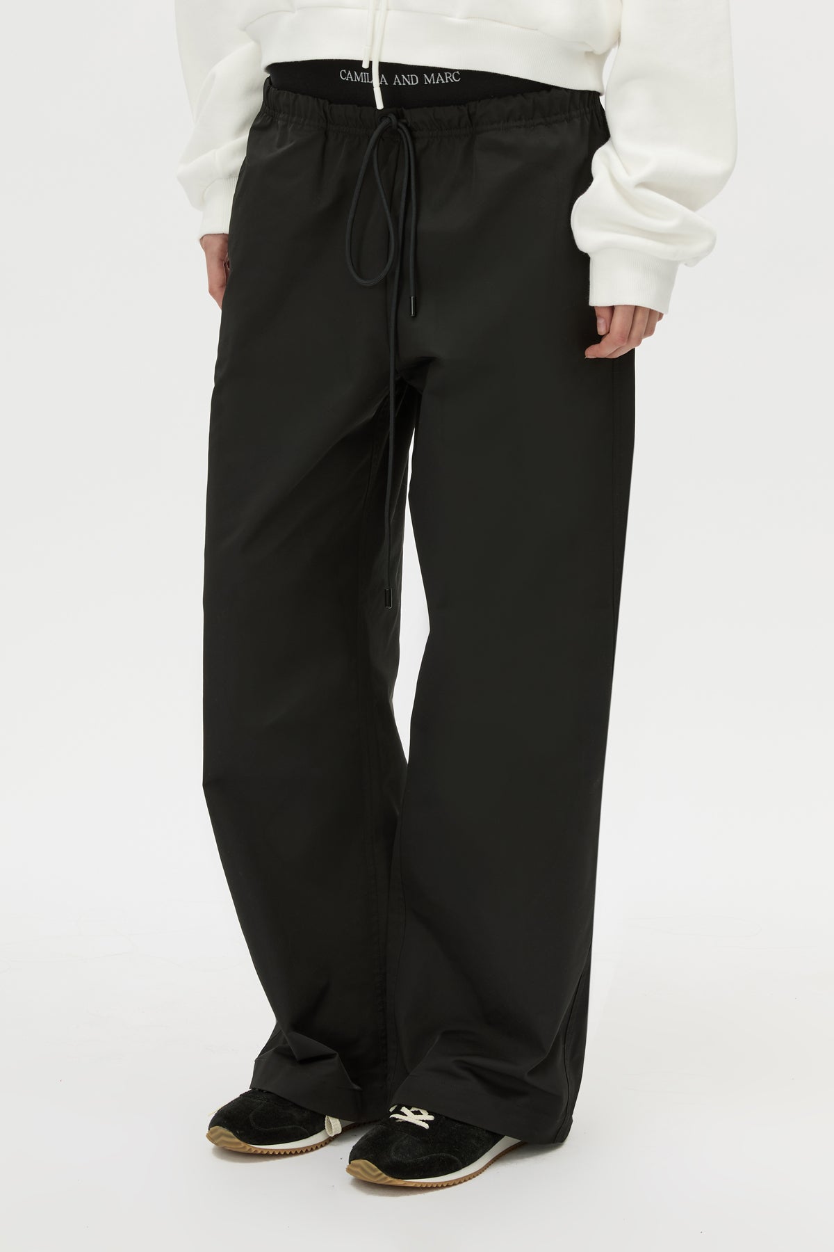 Cropped view CAMILLA AND MARC Dia Elastic Detail Pant in Black with logo detail.