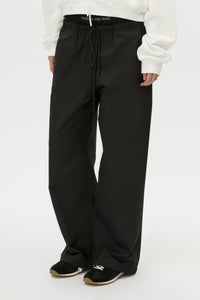 Cropped view CAMILLA AND MARC Dia Elastic Detail Pant in Black with logo detail.