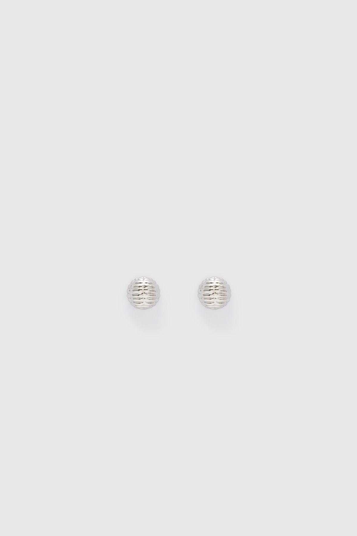 Ghost view CAMILLA AND MARC Eagan Studs in silver with petite semi‑sphere design and ruched texture.