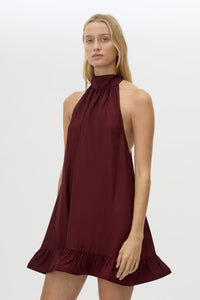 Cropped view CAMILLA AND MARC Elsen Halter Mini Dress in Burgundy with open back, tie‑up neck and fluted crinoline hem.