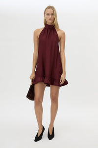 Front view CAMILLA AND MARC Elsen Halter Mini Dress in Burgundy with open back, tie‑up neck and fluted crinoline hem.