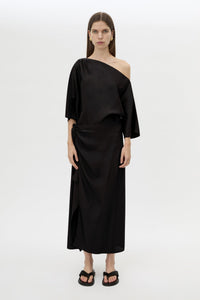 Front styled view CAMILLA AND MARC Elsen Off Shoulder Midi Dress in Black with asymmetric neckline.