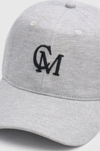 Cropped view CAMILLA AND MARC Isolde Embroidered Logo Cap in Grey Marle and black with front embroidered artwork.