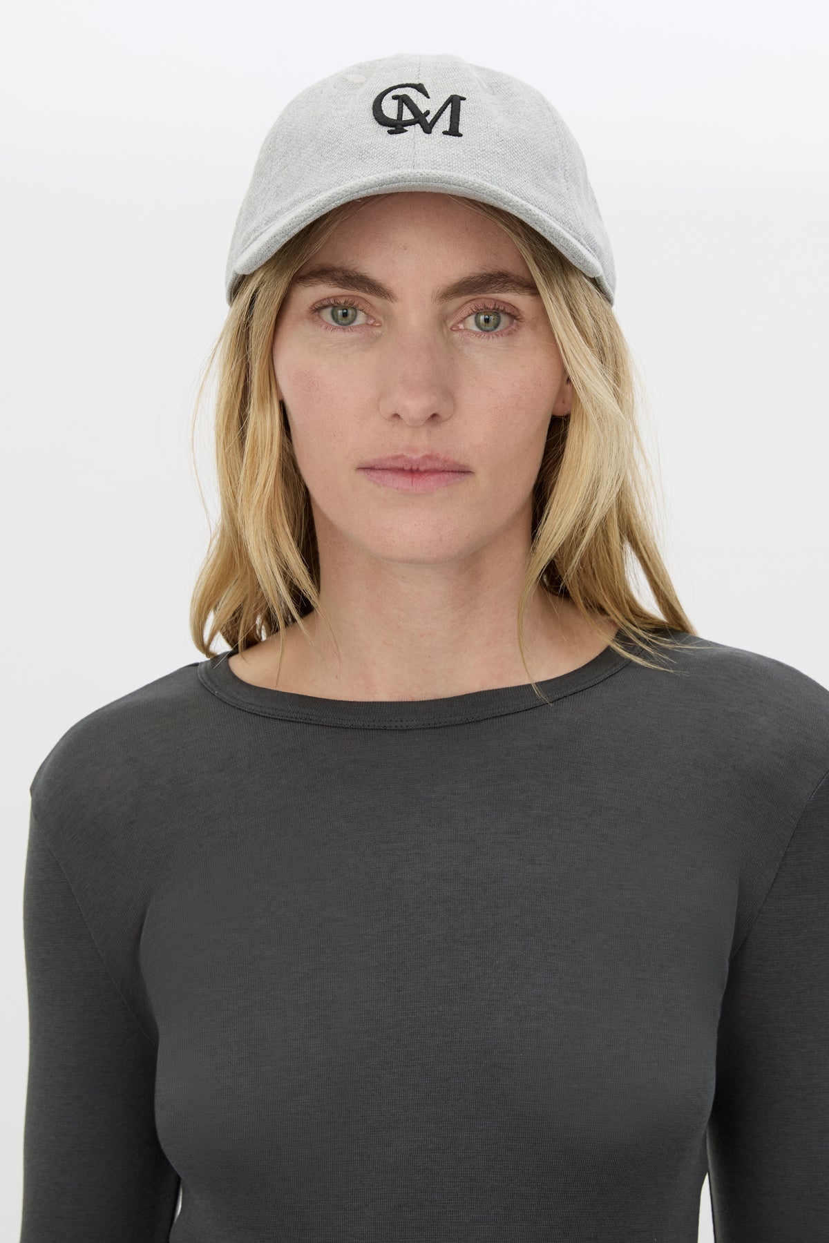 Front view CAMILLA AND MARC Isolde Embroidered Logo Cap in Grey Marle and black with front embroidered artwork.