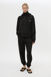 Front view CAMILLA AND MARC Lyra Embroidered Hoodie in Black and White with exposed quarter‑zip opening.