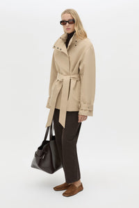 Three-quarter view CAMILLA AND MARC Mahdavi Puffer Jacket in Tan with boxy silhouette and double‑breasted design.