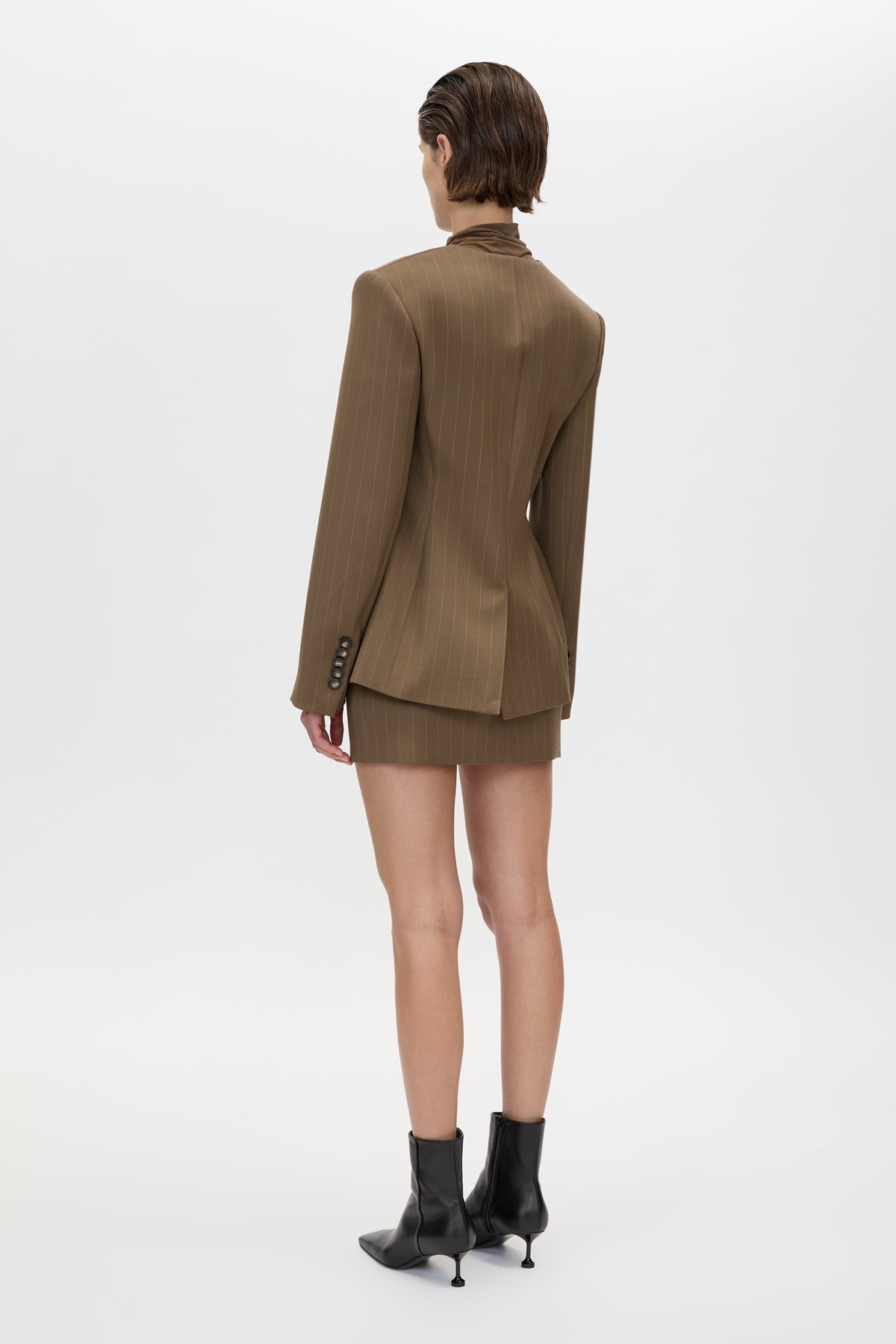Back view CAMILLA AND MARC Maxim Tailored Mini Skirt in Cinnamon Brown, featuring a wool‑blend pinstripe fabrication.