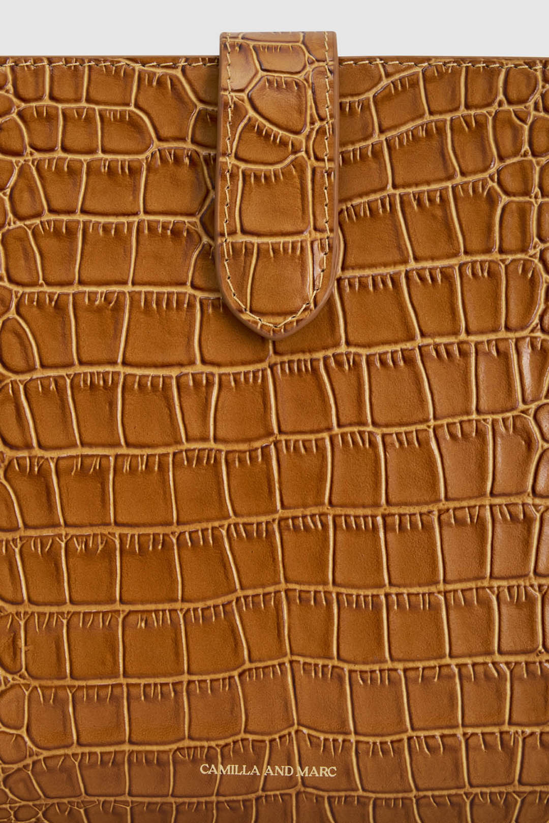 Cropped view CAMILLA AND MARC Mette Croc Clutch in tan croc‑embossed leather.