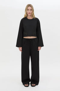 Front view CAMILLA AND MARC Niami Crochet Cropped Top in black with cut‑away crochet detailing at hem.