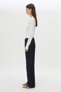 Side view CAMILLA AND MARC Orion Slub Jersey Bodysuit in White with long sleeves, and rib button placket.