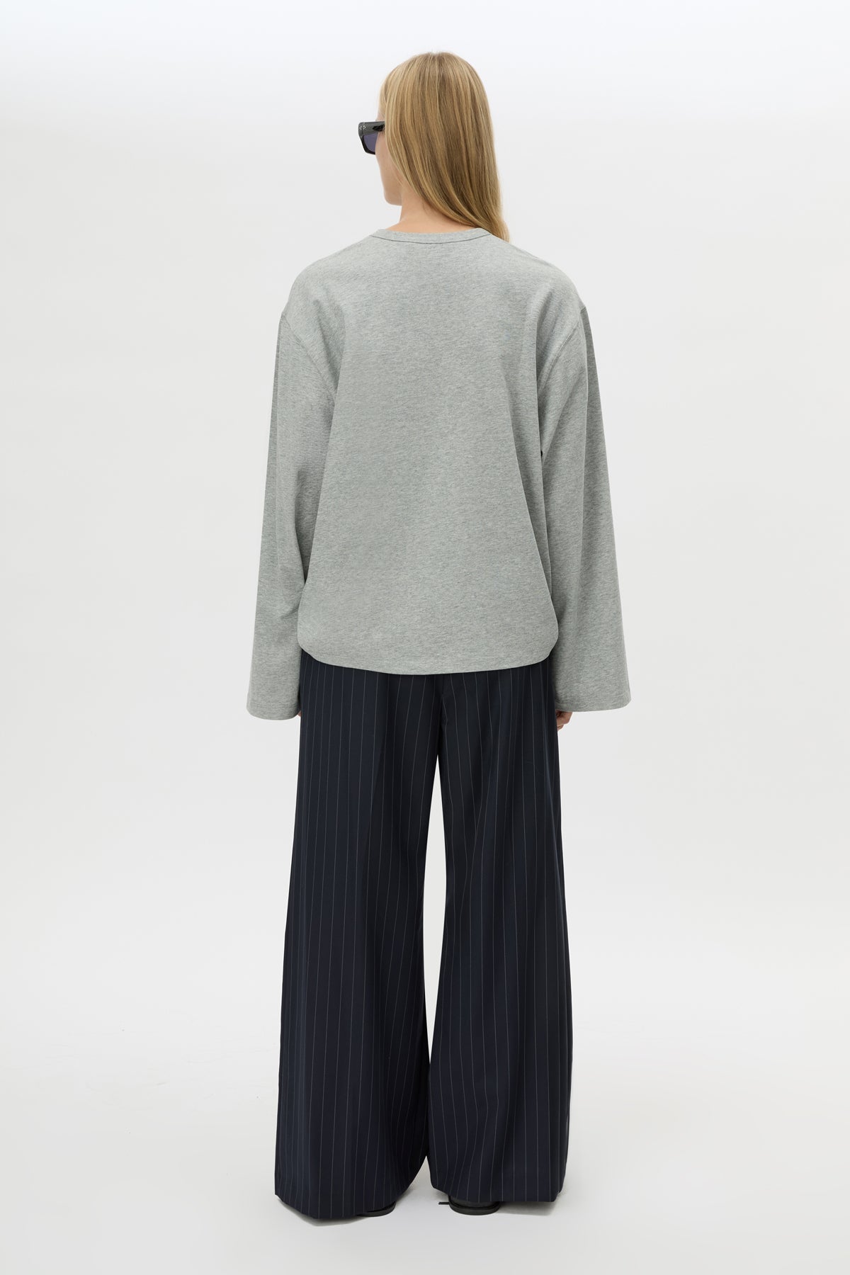 Back view CAMILLA AND MARC Peretti Long Sleeve Tee in Grey Marle with relaxed fit and wide sleeves.