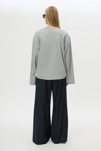 Back view CAMILLA AND MARC Peretti Long Sleeve Tee in Grey Marle with relaxed fit and wide sleeves.
