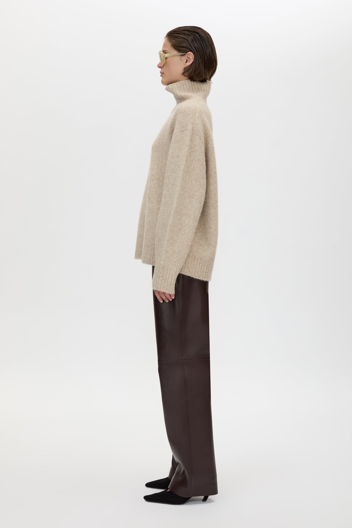 Side view CAMILLA AND MARC Selita Leather Pant in Burgundy with straight‑leg panelled leather construction.