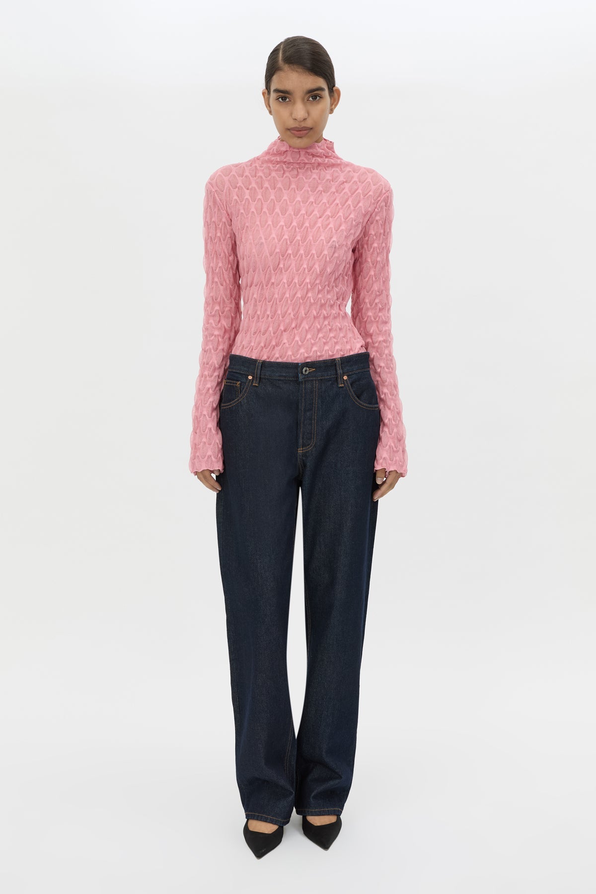 Front styled view CAMILLA AND MARC Sissil Top in Powder Pink jersey with long sleeves and funnel neck.