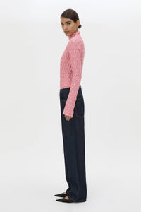Side view CAMILLA AND MARC Sissil Top in Powder Pink jersey with long sleeves and funnel neck.