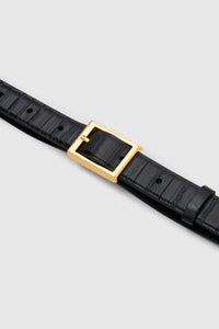 Cropped view CAMILLA AND MARC Sonny Eel Belt in Black leather with textured eel embossing.