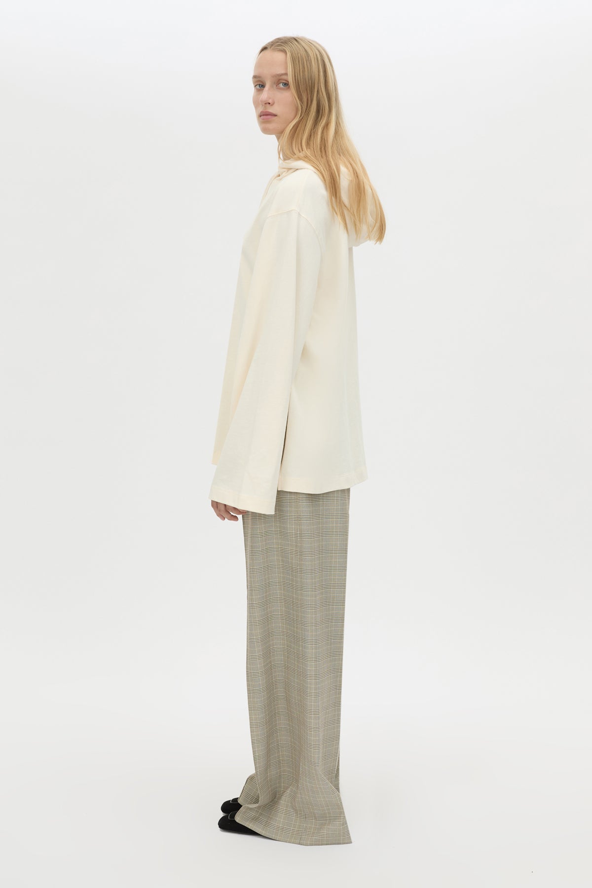 Side view CAMILLA AND MARC Studio Hoodie in White with relaxed long‑sleeve design and hooded silhouette.  