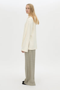 Side view CAMILLA AND MARC Studio Hoodie in White with relaxed long‑sleeve design and hooded silhouette.  