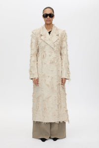 Front styled view CAMILLA AND MARC Tundra Double Breasted Coat in Stone with exaggerated shoulders, fitted waist and jacquard floral texture.