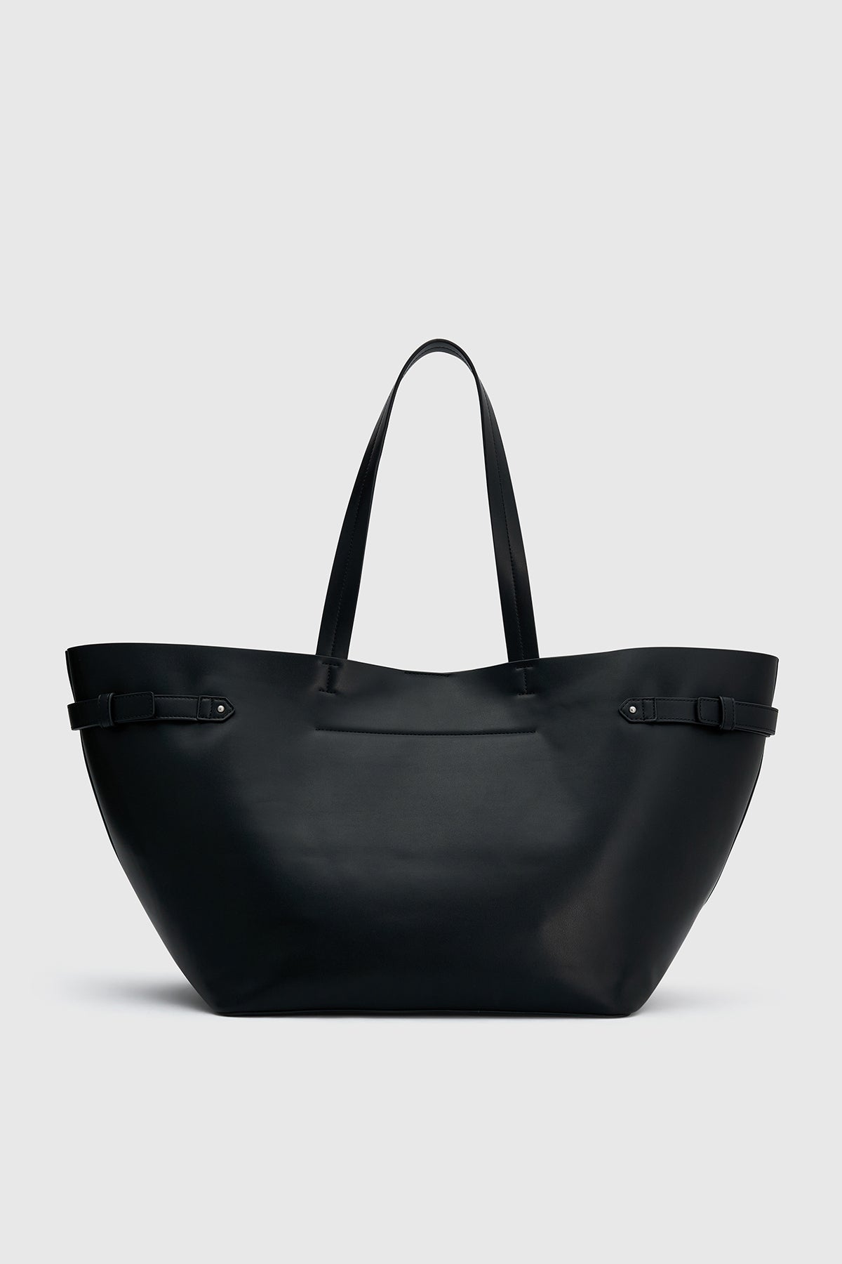 Back view CAMILLA AND MARC Willa Tote in Black with side strap and buckle detailing and magnetic button closure.