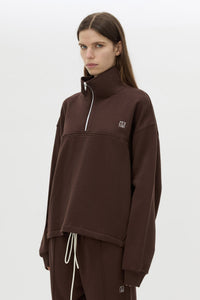Cropped view CAMILLA AND MARC Zylus funnel neck pullover sweater in chocolate/white with contrast embroidered monogram.