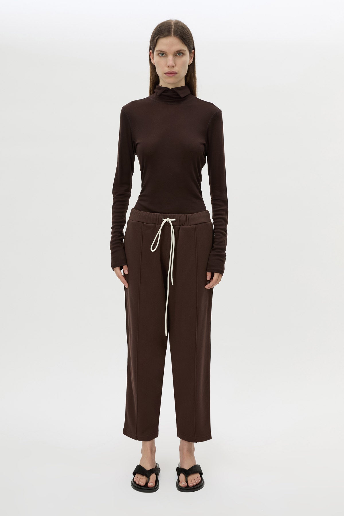 Front view CAMILLA AND MARC Zylus straight-leg tracksuit pant in chocolate with embroidered monogram.